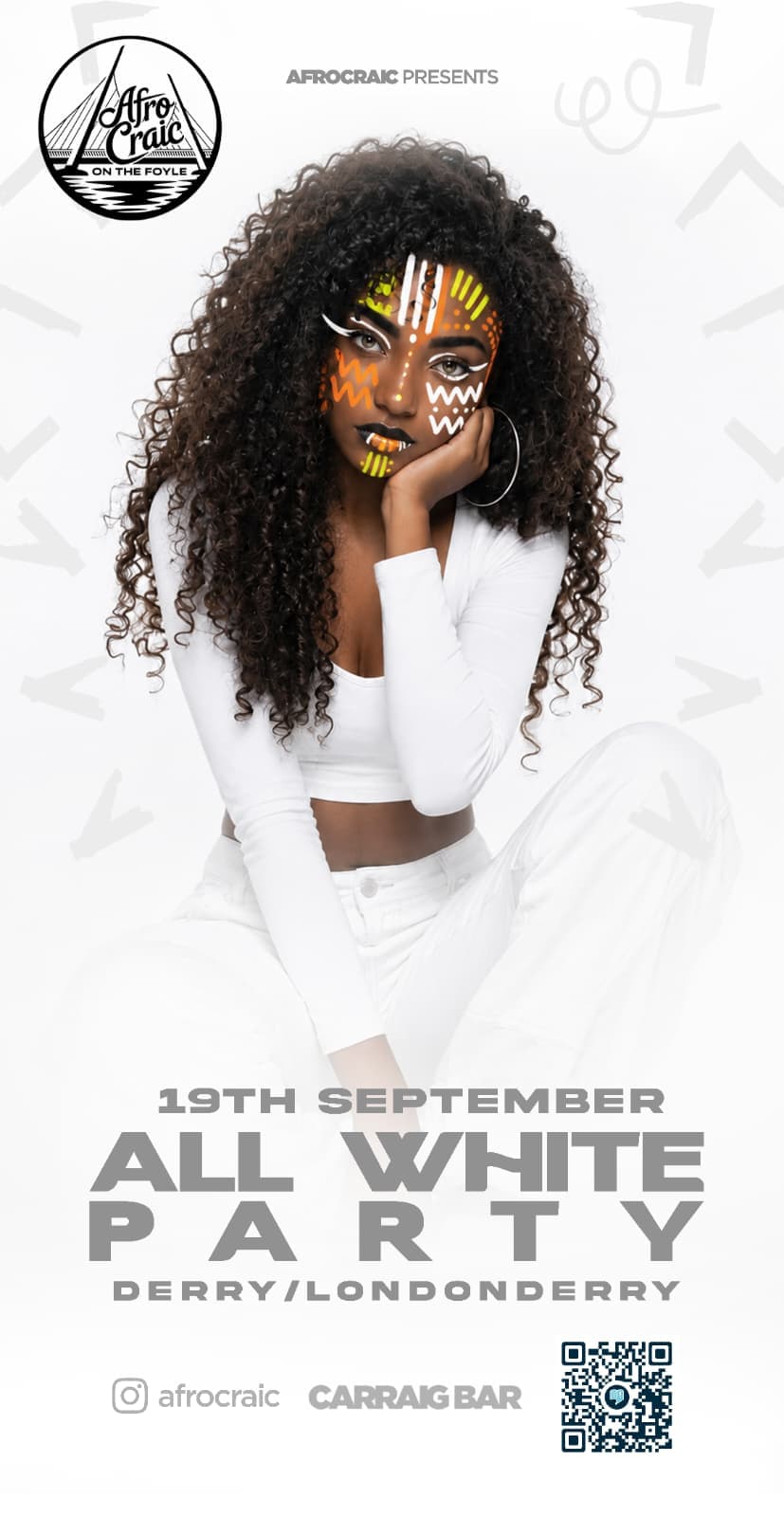 Model dressed in white with bright African-inspired face art