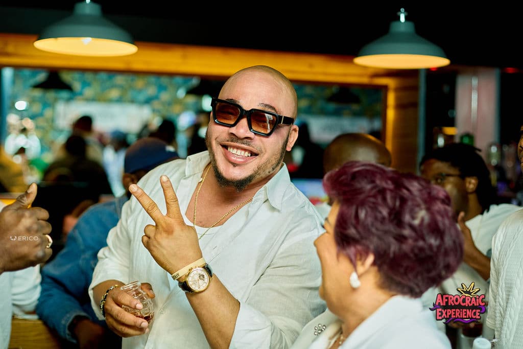 A smiling guest sharing the energy of the All White Party